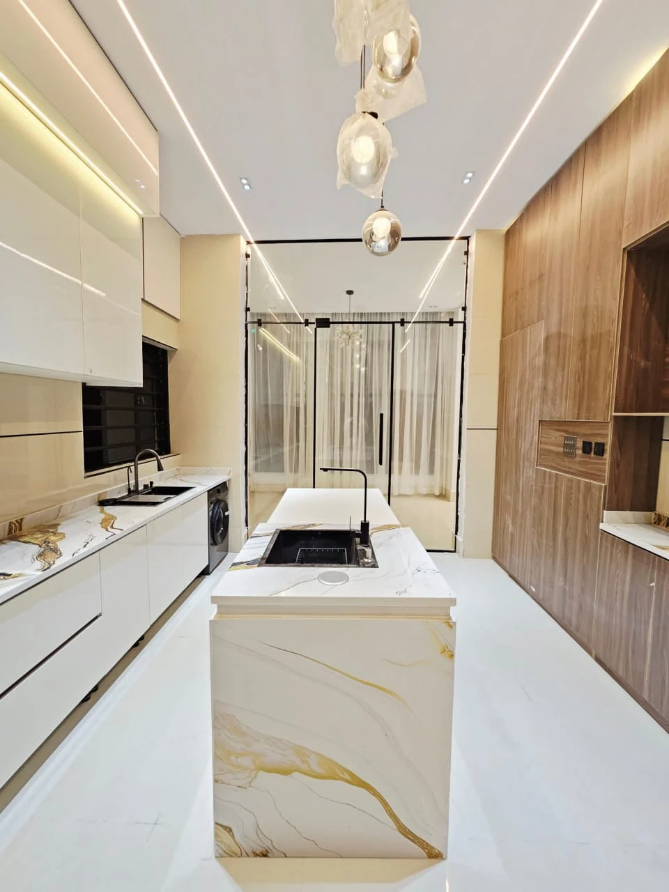 White kitchen island and warm wood finish cabinetry